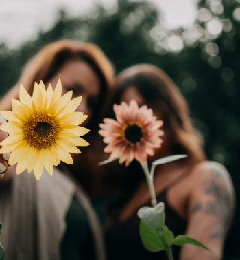 Two ladies and a sunflower